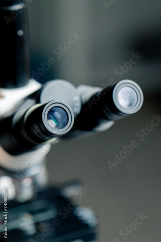 close-up in a veterinary clinic there is a new microscope with glass in the robot