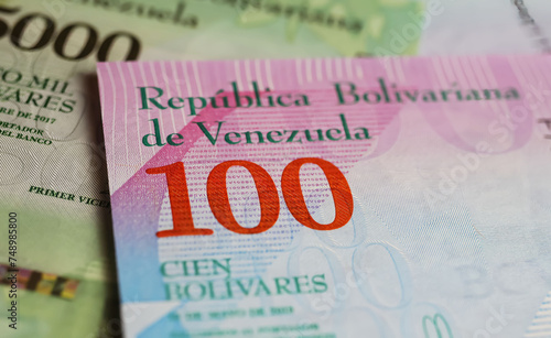 Closeup of old Venezuela central bank 100 Bolivar currency banknote (focus on center)