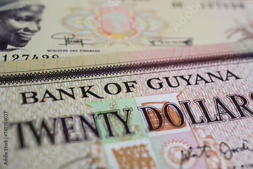 Closeup of old Guyana dollar currency banknote (focus on center)