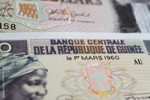 Closeup of old Guinea central bank GNF Franc currency banknote from 60s (focus on center) photo