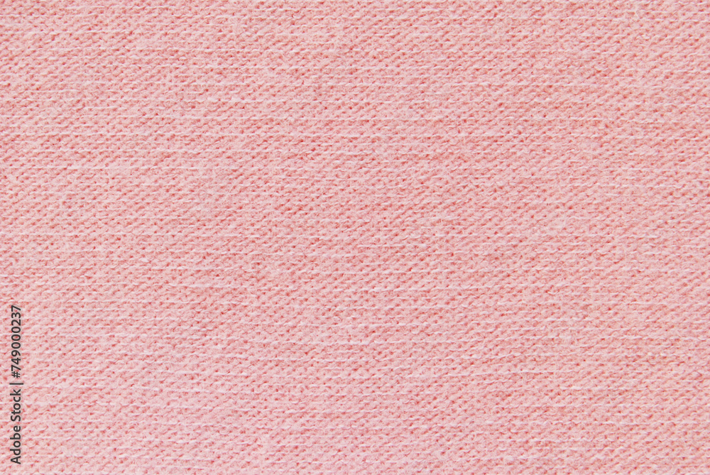Light pink soft jersey fabric pattern texture as background Light pink soft jersey fabric pattern texture as background