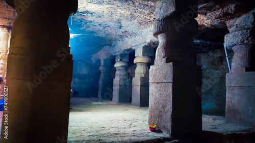 old stone pillars in the jogeshwari caves in mumbai in india. photo