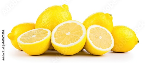 A pile of lemons stacked on top of each other, showcasing their vibrant yellow color and textured peel. The lemons are fresh and bright, ready to be used in cooking or for making refreshing drinks.