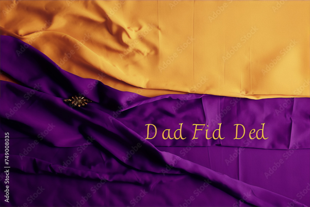 Purple and gold fabric with a gold brooch and the words "Dad Fid Ded" written in gold letters. - obrazy, fototapety, plakaty 