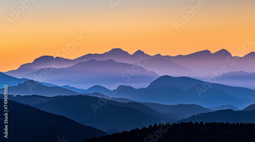 A mountain range silhouette at twilight. © Thomas