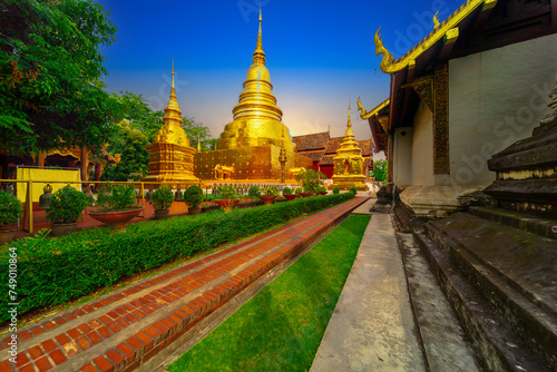Beautiful Wat Buddhist temples in Chiangmai Chiang mai Thailand. Decorated in beautiful ornate colours of red and Gold and Blue. Lovely sunset