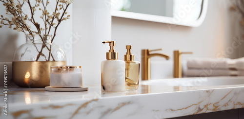 a room with a bathroom with white marble countertop and gold