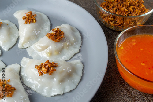 Choipan or Choi pan is a Pontianak snack made from rice flour. The filling is shaved jicama, chives cooked with dried shrimp photo