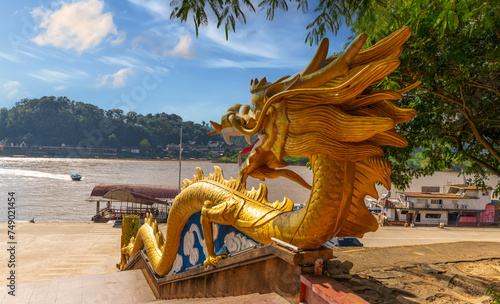 Golden Dragon with wide open mouth wrapped down the Stairs at the Golden Triangle on the Laos Side facing Thailand and Myanmar  © Elias Bitar