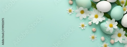 easter flowers and eggs on a light green background