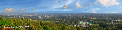 Panorama view of Chiangmai Chiang Mai city taken from Doi Suthep Mountains. Lovely views of the Old city at Sunset Sunrise lovely tropical mountains and beautiful nature in the foreground photo