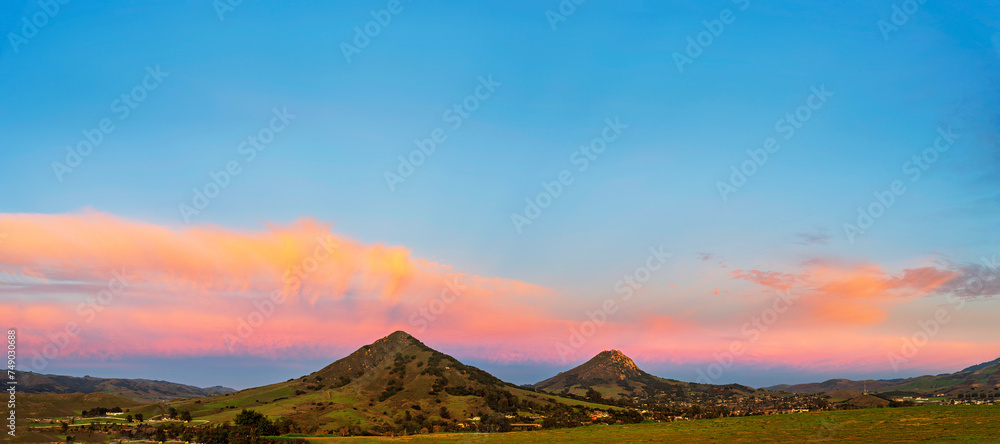 Panorama of mountain peaks at sunrise, sunset Panorama of mountain peaks at sunrise, sunset