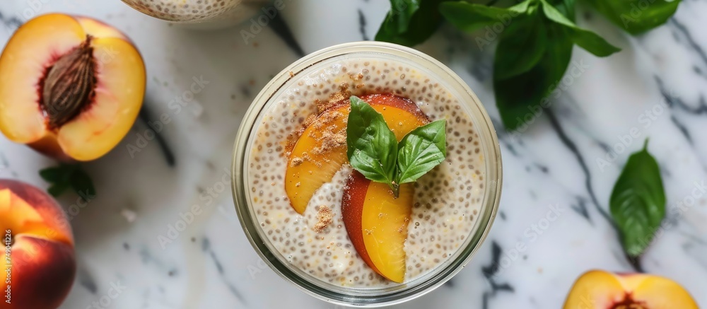A peach and mint smoothie is placed on a marble table. The smoothie is garnished with fresh mint leaves and peach slices, creating a vibrant and refreshing image. A peach and mint smoothie is placed on a marble table. The smoothie is garnished with fresh mint leaves and peach slices, creating a vibrant and refreshing image.