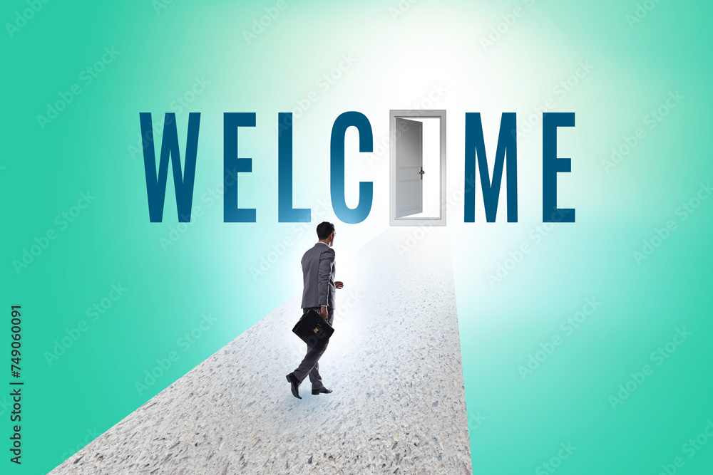 Businessman on the road leading to welcome sign Businessman on the road leading to welcome sign