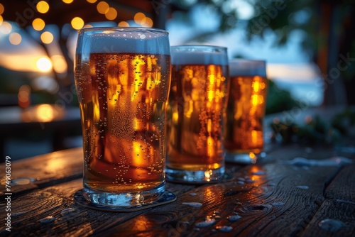 Three refreshing glasses of beer on a wood table with a warm, festive bokeh background, conveying a sense of celebration and leisure
