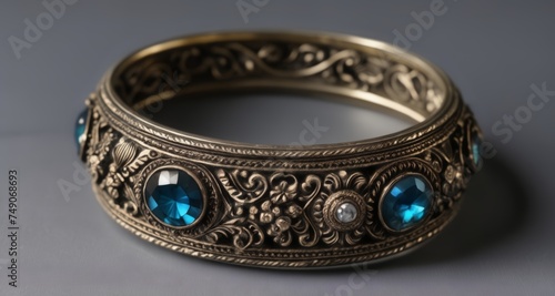  Elegant gold bracelet with blue gemstones, perfect for a sophisticated look