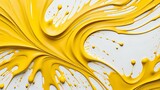 Vivid yellow paint dynamically swirling with splashes and drops, creating an energetic abstract pattern.