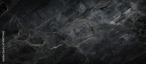 This high-resolution black and white marble texture background showcases a dark gray glossy marble stone pattern, perfect for digital wall tiles and floor tiles. The intricate details of the dark grey photo