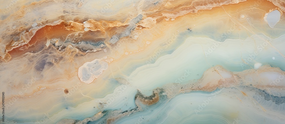 This close-up shot showcases the intricate patterns of a brown and white marble slab, with a natural aqua green onyx texture. The polished surface is perfect for home decor, such as floor and wall This close-up shot showcases the intricate patterns of a brown and white marble slab, with a natural aqua green onyx texture. The polished surface is perfect for home decor, such as floor and wall