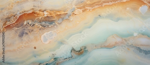 This close-up shot showcases the intricate patterns of a brown and white marble slab, with a natural aqua green onyx texture. The polished surface is perfect for home decor, such as floor and wall