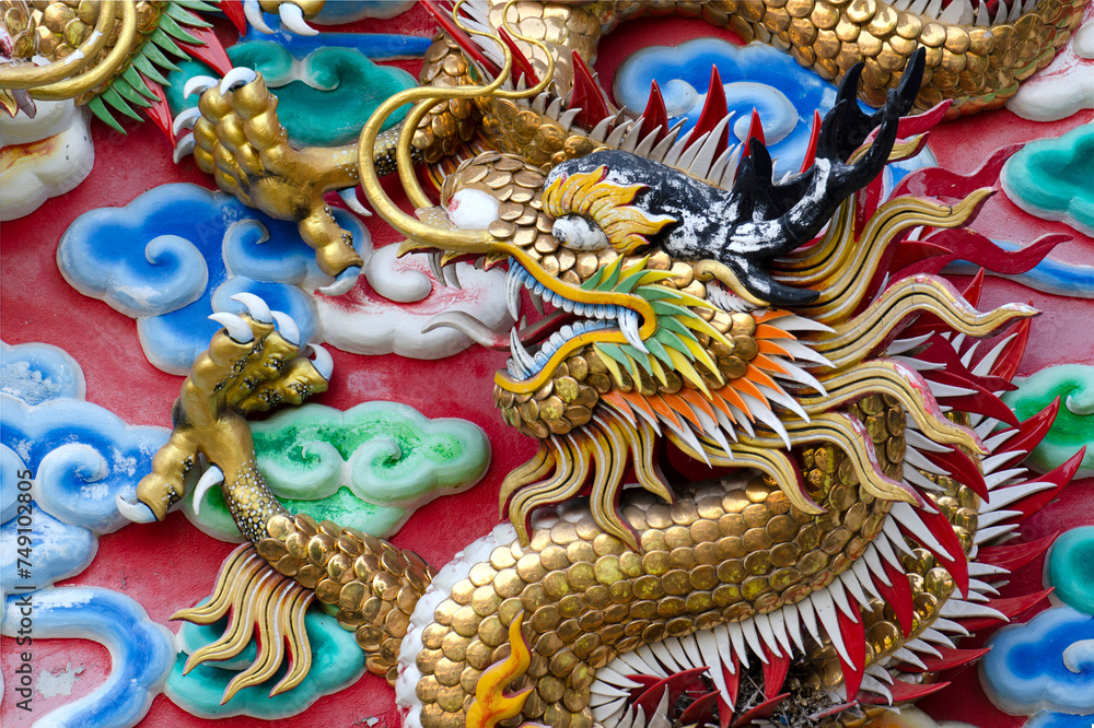 Dragon, head sculpture on wall of temple in Thailand, Symbol of wealth, prosperity. Dragon, head sculpture on wall of temple in Thailand, Symbol of wealth, prosperity.