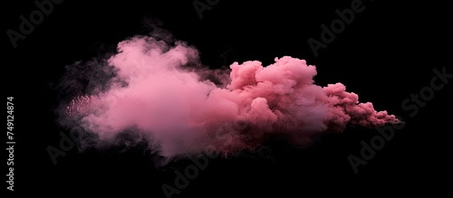 A pink cloud of smoke billows out against a stark black background, creating a striking contrast. The smoke appears vibrant and dynamic, filling the space with its colorful presence.