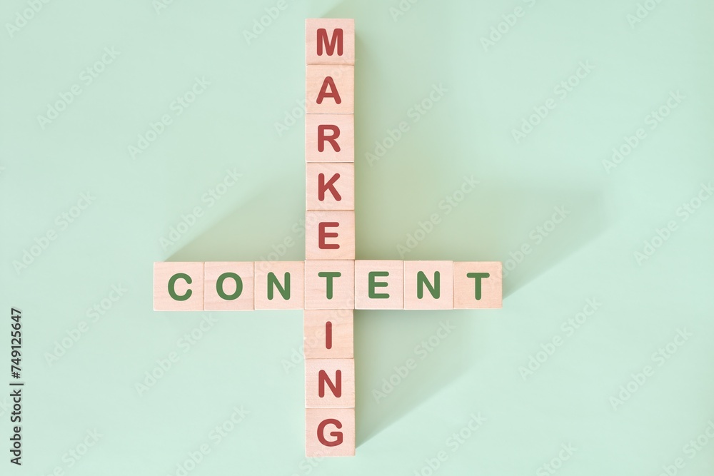 Content marketing strategy concept. Crossword puzzle flat lay typography in green background.