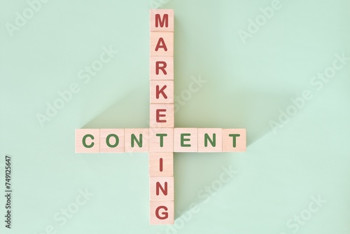 Content marketing strategy concept. Crossword puzzle flat lay typography in green background.