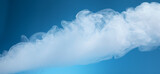 A plume of smoke drifting in front of a blue gradient background