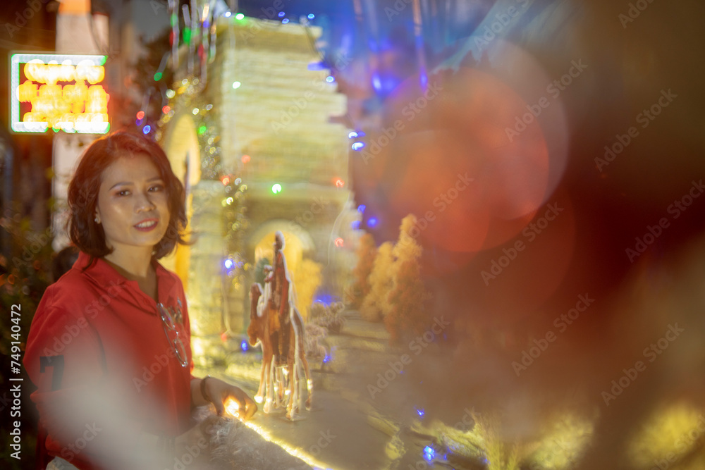 Obraz premium Thoughtful young woman against gray background,Rear view of woman standing against white wall,Beautiful young woman against wall