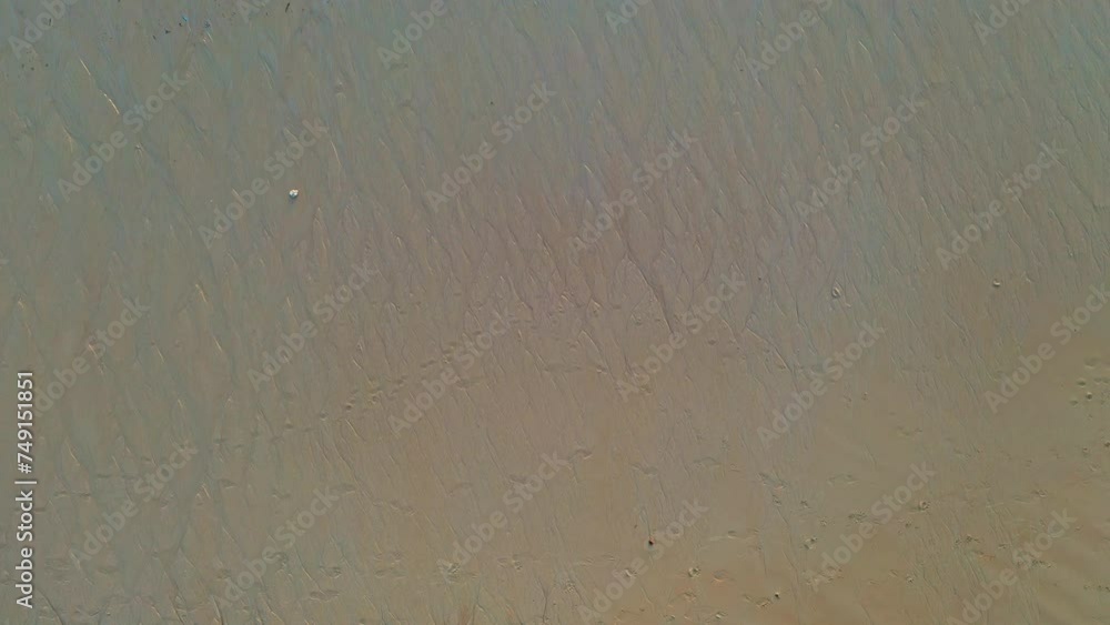 aerial top view sea waves seamless loop on the white sand beach. .Wave after wave swept towards the shore on white sand beach..green sea, white bubble waves,and clear sand landscape. Paradise beach.. aerial top view sea waves seamless loop on the white sand beach. .Wave after wave swept towards the shore on white sand beach..green sea, white bubble waves,and clear sand landscape. Paradise beach..