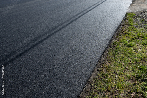 Wallpaper Mural Freshly repaved asphalt road, closeup detail as a background
 Torontodigital.ca