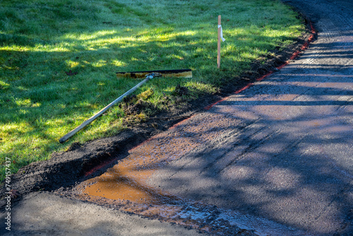 Asphalt repaving project in progress, old asphalt ground down in preparation for repaving
 photo