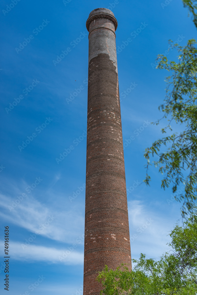 A notable feature of the town is the 47-meter-high smokestack constructed in 1890 for El Progreso Mining Company 