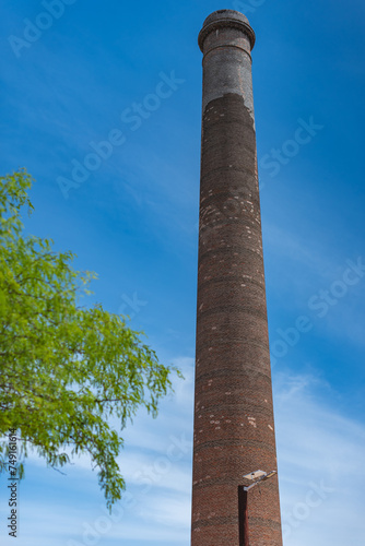 A notable feature of the town is the 47-meter-high smokestack constructed in 1890 for El Progreso Mining Company "La Ramona", named after Saint Raymond. El Triunfo, Baja California, Mexico. 