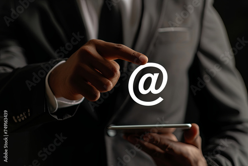Businessman clicking on email icon, contact by email concept