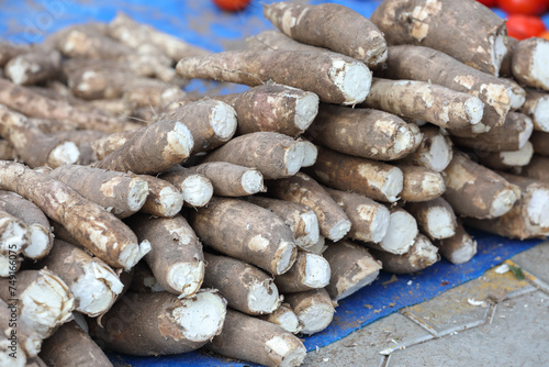 pile of Fresh Cassava roots for sale at farmer's market	
 photo