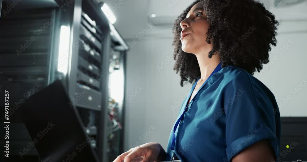 Smile, technician and woman on laptop in data center for cyber security, thinking and update database. Happy engineer, computer or server room for typing, problem solving and information technology Smile, technician and woman on laptop in data center for cyber security, thinking and update database. Happy engineer, computer or server room for typing, problem solving and information technology