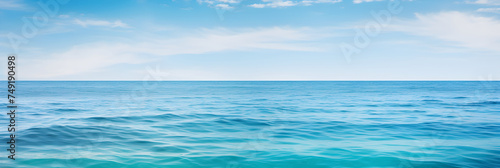 Mesmerizing Blue Ocean Expanse: A Symbiosis of Sky, Water, and Light