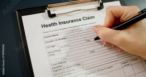 Hand Filling Health Insurance Claim Form