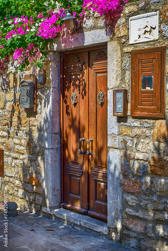 Colorful streets with beautiful houses and curly flowers in Bodrum photo