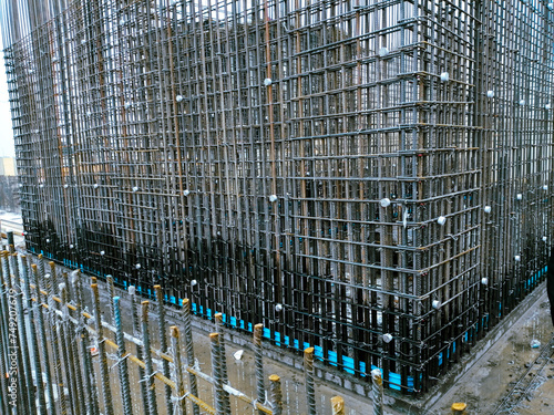 A large building with a lot of metal bars and wires