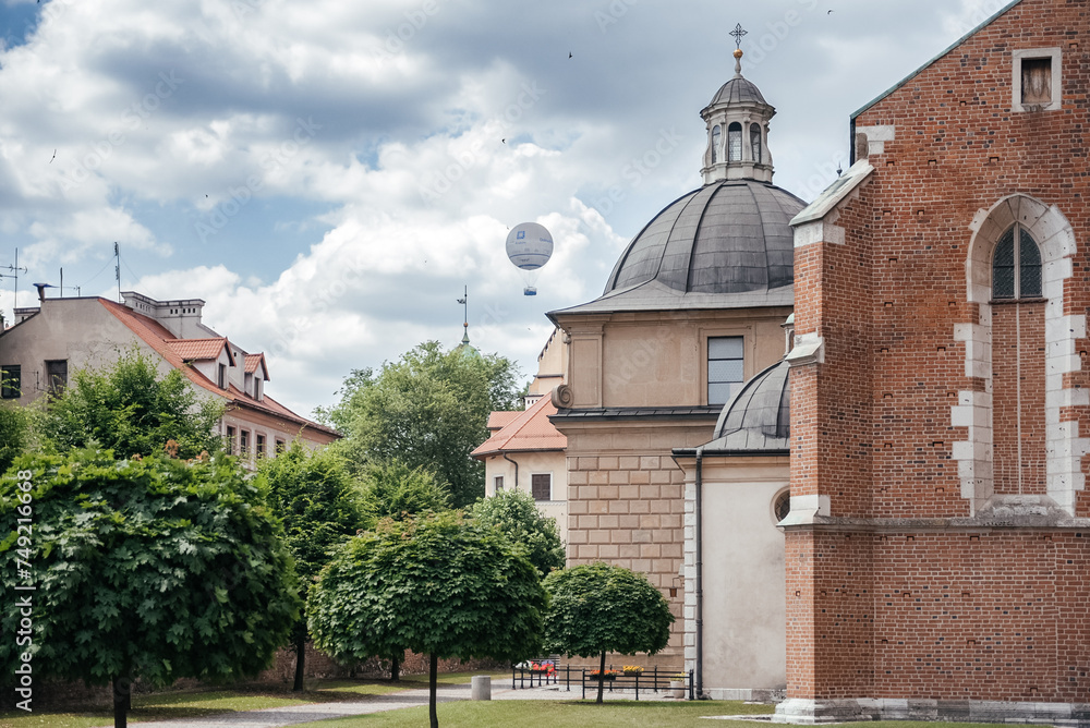 Historic Krakow Skyline: Church Domes and Hot Air Balloon