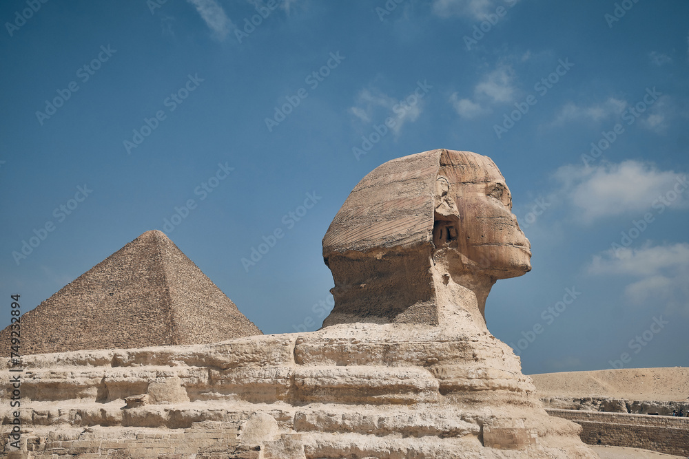 Great Sphinx of Giza opposite Pyramid of Khufu at background. Giza ...
