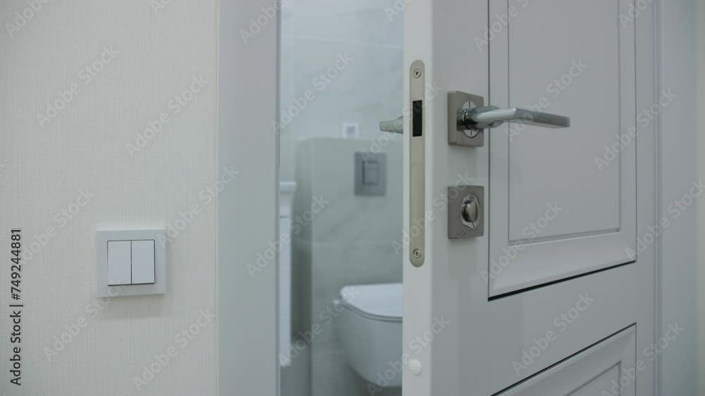 View of the bathroom in the apartment through the door View of the bathroom in the apartment through the door