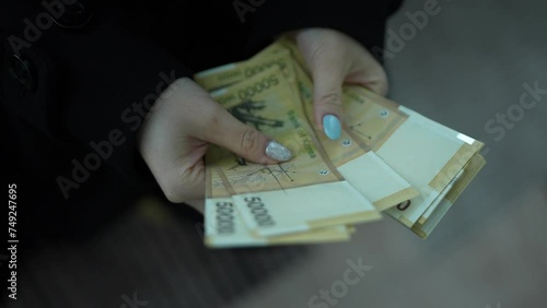 Counting South Korean 50,000 Won Banknotes