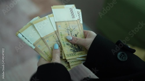 Counting South Korean 50,000 Won Banknotes