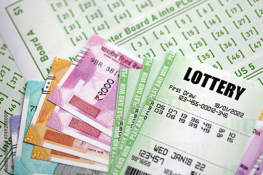 Green lottery tickets and indian rupees money bills on blank with numbers for playing lottery close up Green lottery tickets and indian rupees money bills on blank with numbers for playing lottery close up