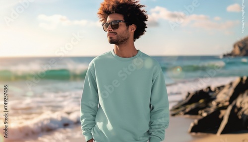 Man Standing on Beach Next to Ocean