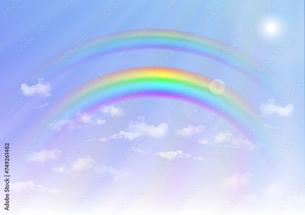 Rainbow on blue sky background 虹のかかった日が差し込む雨上がりの空